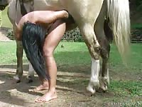 Kinky slut uses horse cock during farm sex