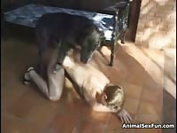 Sexy blonde babe animal sex fun with big black dog