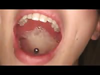 Kinky lady with piercing on her tongue swallows cum